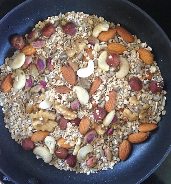 Nuts and oats roasting in the pan